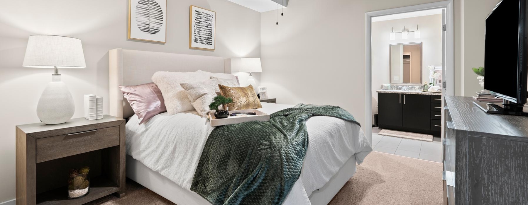 a bedroom with a bed and a television